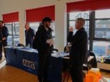 UHNM staff member talking to student 